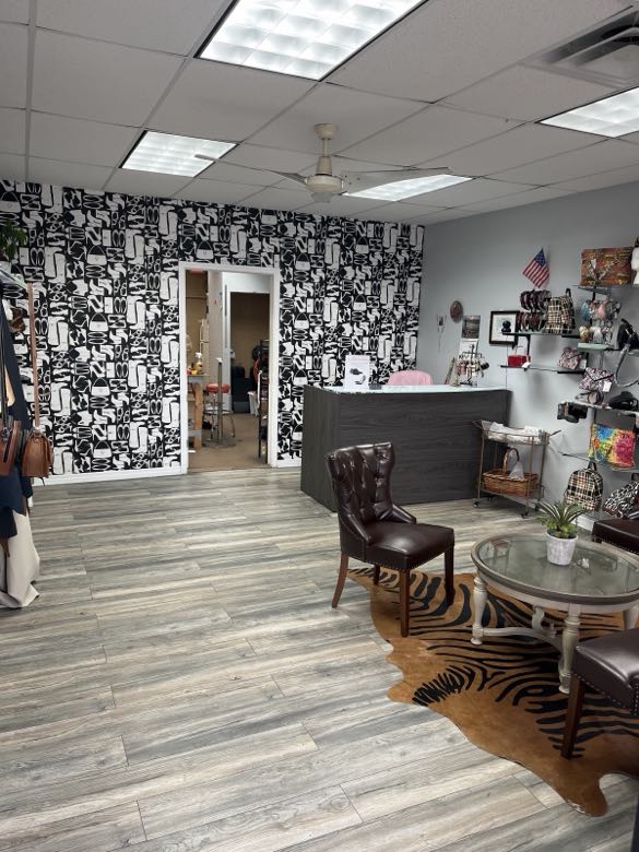The shop's waiting area with handbags on display